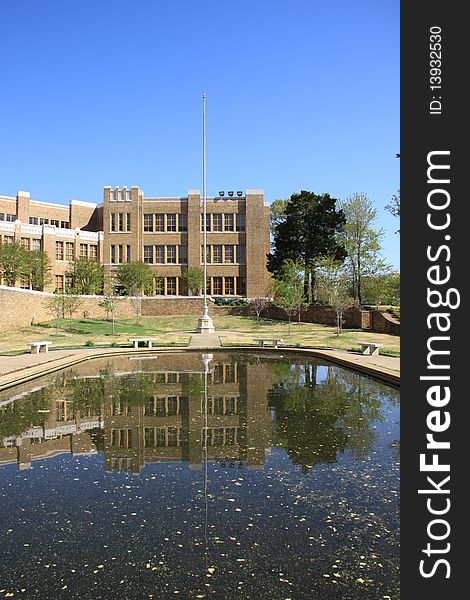 Image in a high school combined with buildings, water and reflection. Image in a high school combined with buildings, water and reflection.