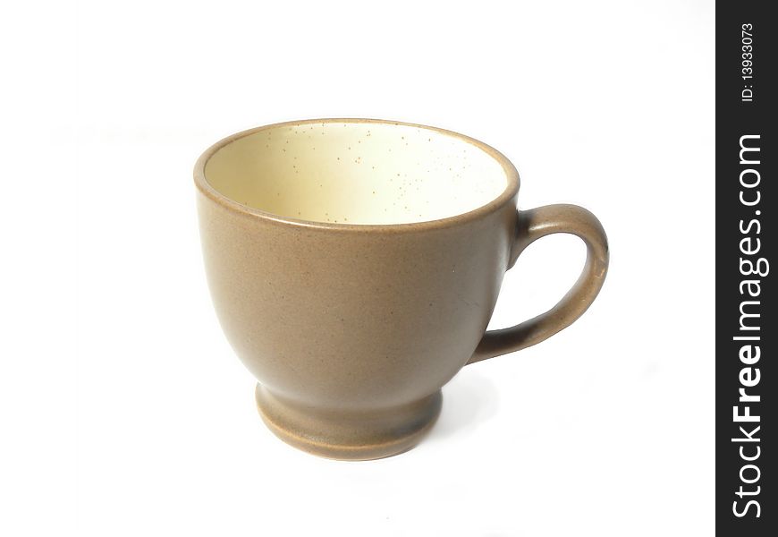Brown mug for coffee or tea isolated on a white background