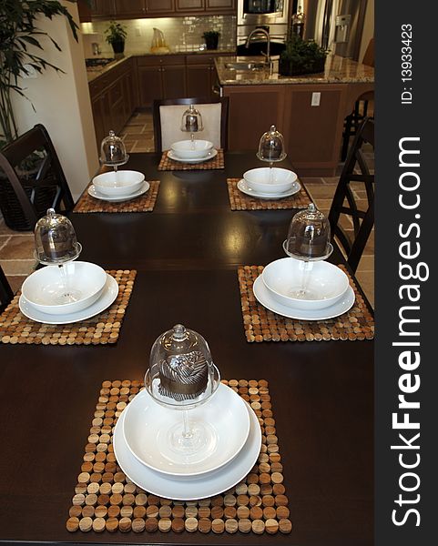 Modern dining table with luxury tableware and decor. Modern dining table with luxury tableware and decor.