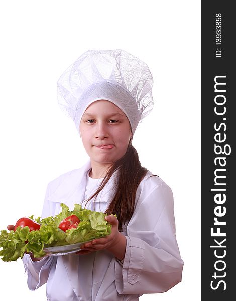 Portrait of teenager girl in chef uniform with vegetarian food. Isolated on white by lighting setup. Portrait of teenager girl in chef uniform with vegetarian food. Isolated on white by lighting setup