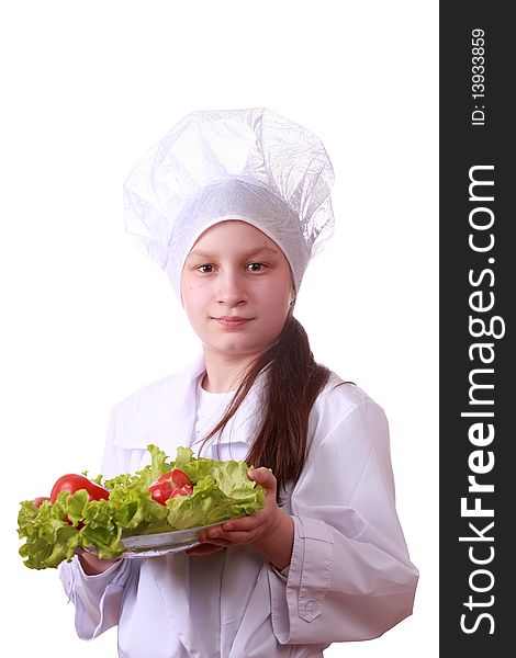 Portrait of teenager girl in chef uniform with vegetarian food. Isolated on white by lighting setup. Portrait of teenager girl in chef uniform with vegetarian food. Isolated on white by lighting setup