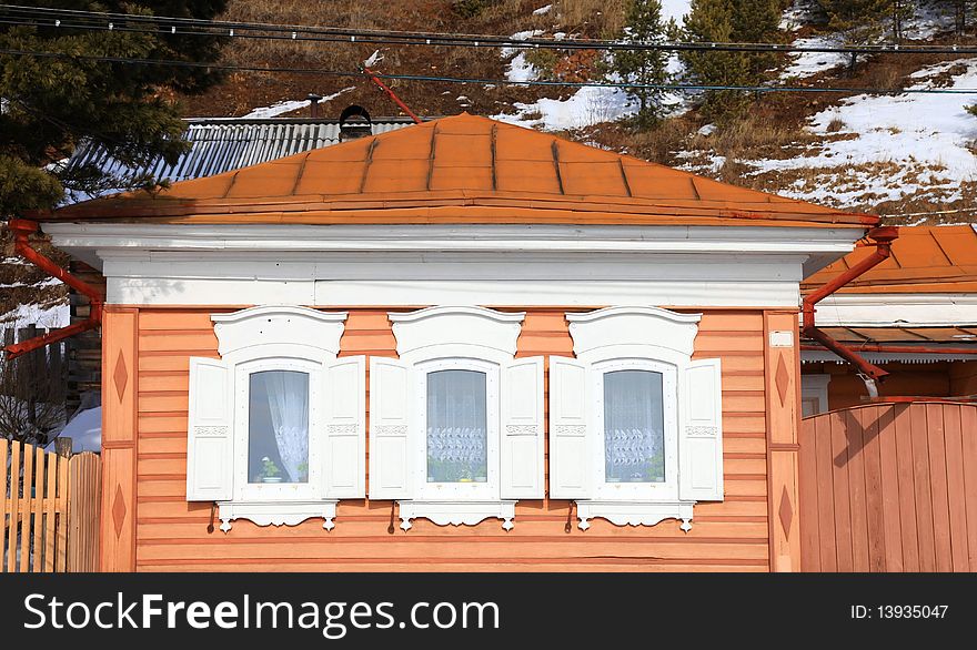 Part of a rural house. Three windows.