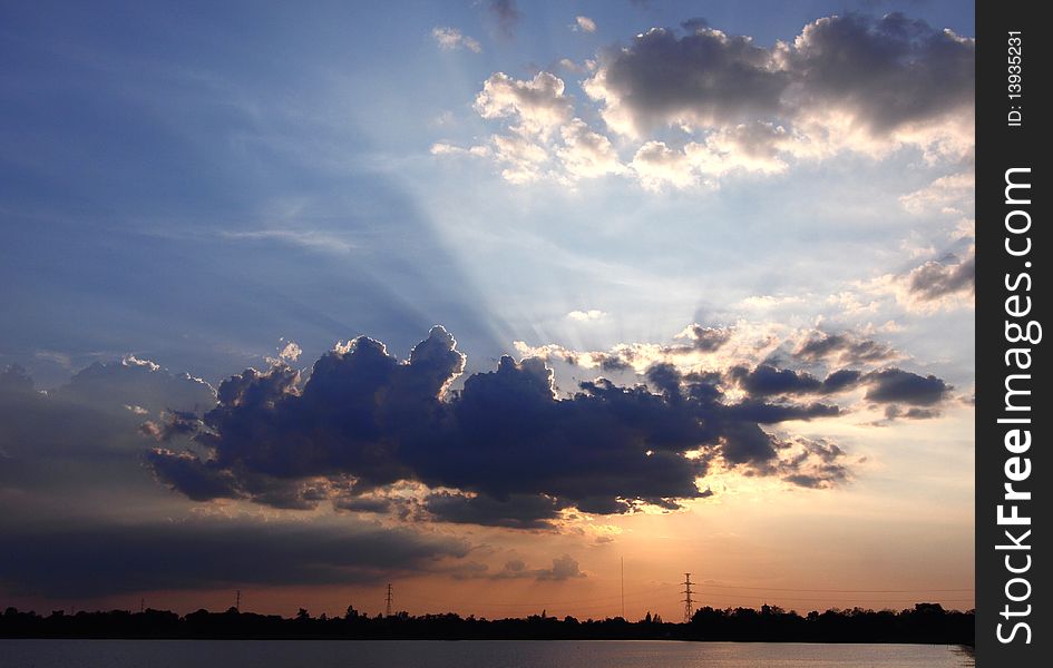 Image of sunset with tree silhouette