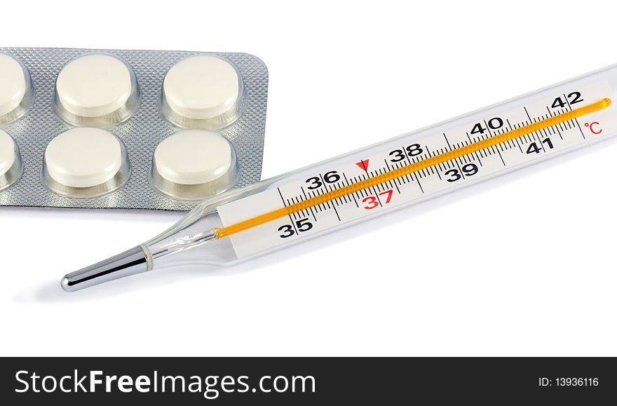 Glass clinical thermometer and pills isolated on white with light shadow. Includes clipping path.