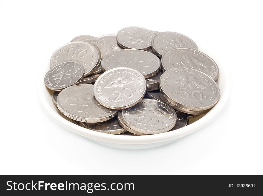 Malaysia coins ten, twenty and fifthy cents in plate with isolated white background. Malaysia coins ten, twenty and fifthy cents in plate with isolated white background