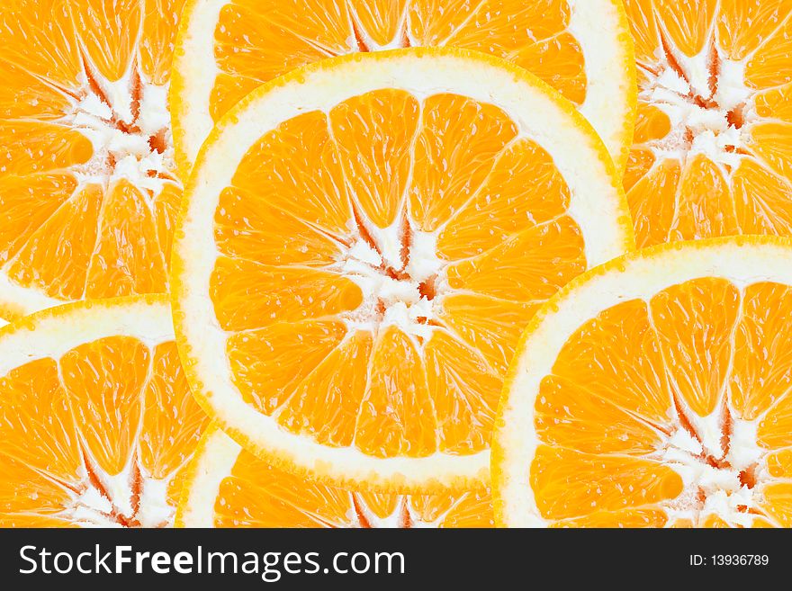 Close up of slices of fresh orange one over another