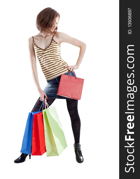 lady with a lot of shopping bags on white background. lady with a lot of shopping bags on white background