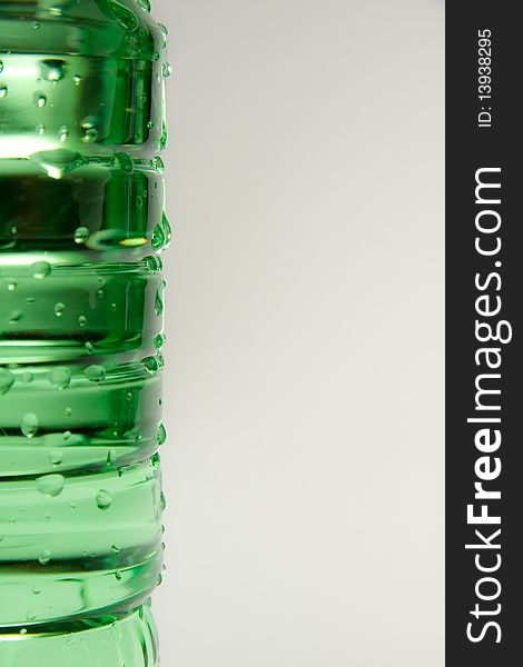 A plastic bottle filled with still water. Image isolated on white studio background. A plastic bottle filled with still water. Image isolated on white studio background.