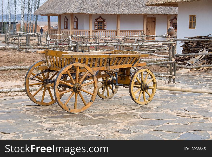 Old wooden cart near house. Old wooden cart near house