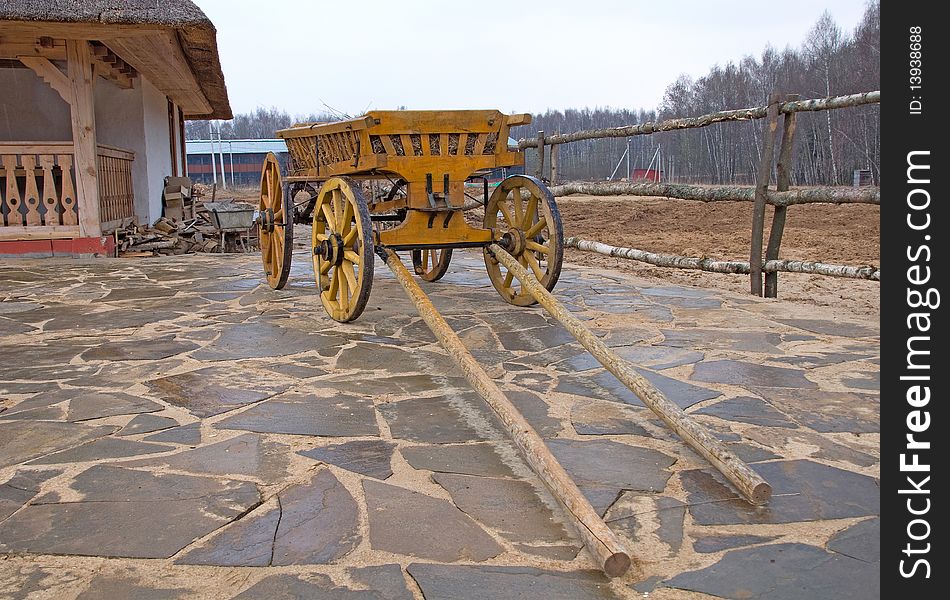 Old wooden cart near house. Old wooden cart near house