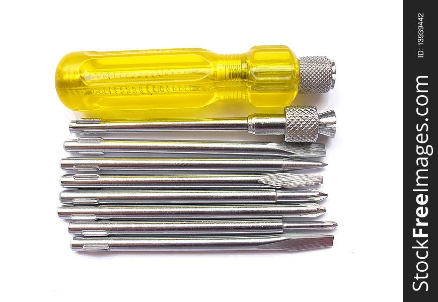 A yellow screw driver set with various attachments isolated on white.