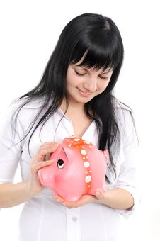 Woman With A Piggy Bank Royalty Free Stock Image