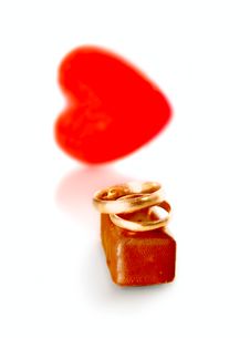 Gold Rings, Heart And Chocolate Candy Royalty Free Stock Photography