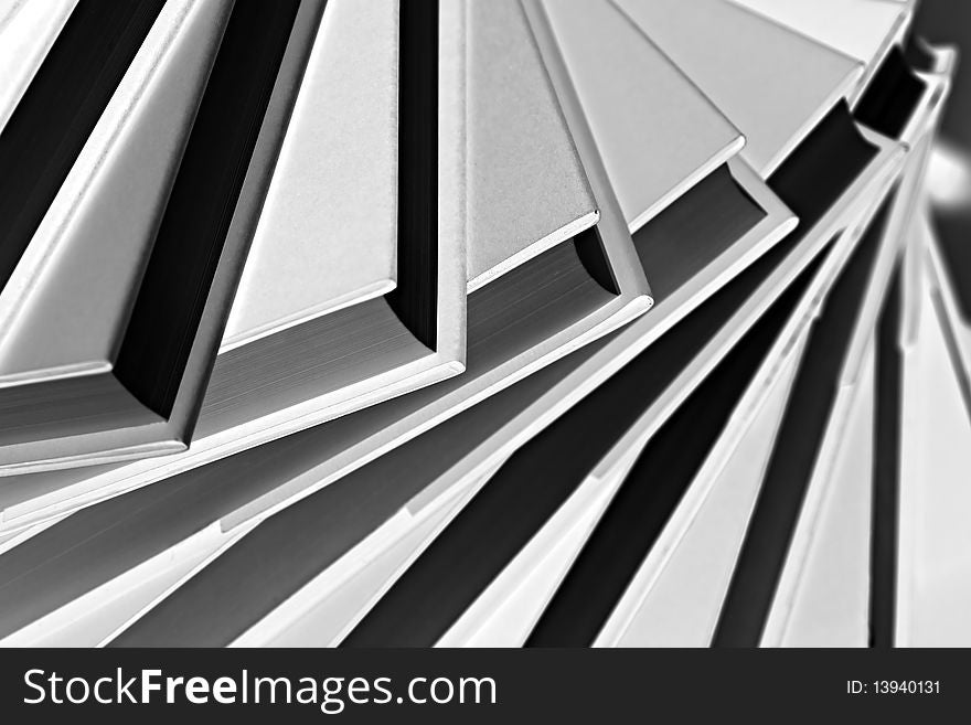 B&W Close-up Of Spiral Stack Of Books