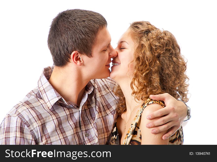 Young couple kissing isolated over white background