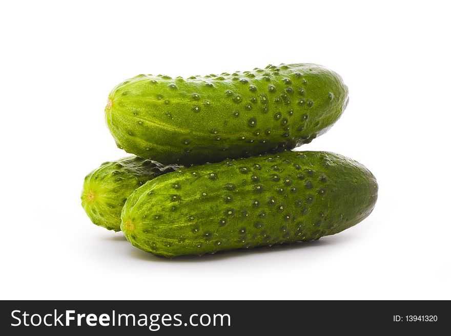 Three cucumbers isolated on white