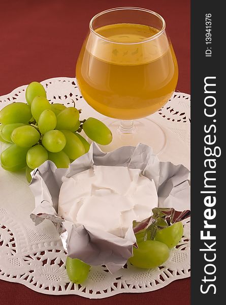 Fresh grapes and cheese with white mold, white wine. Fresh grapes and cheese with white mold, white wine