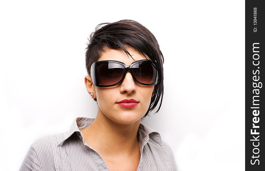 Young girl wearing sunglasses on white background. Young girl wearing sunglasses on white background