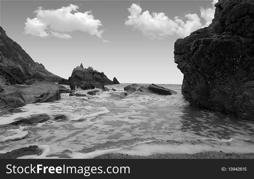 Reef in sea on sky background. Reef in sea on sky background