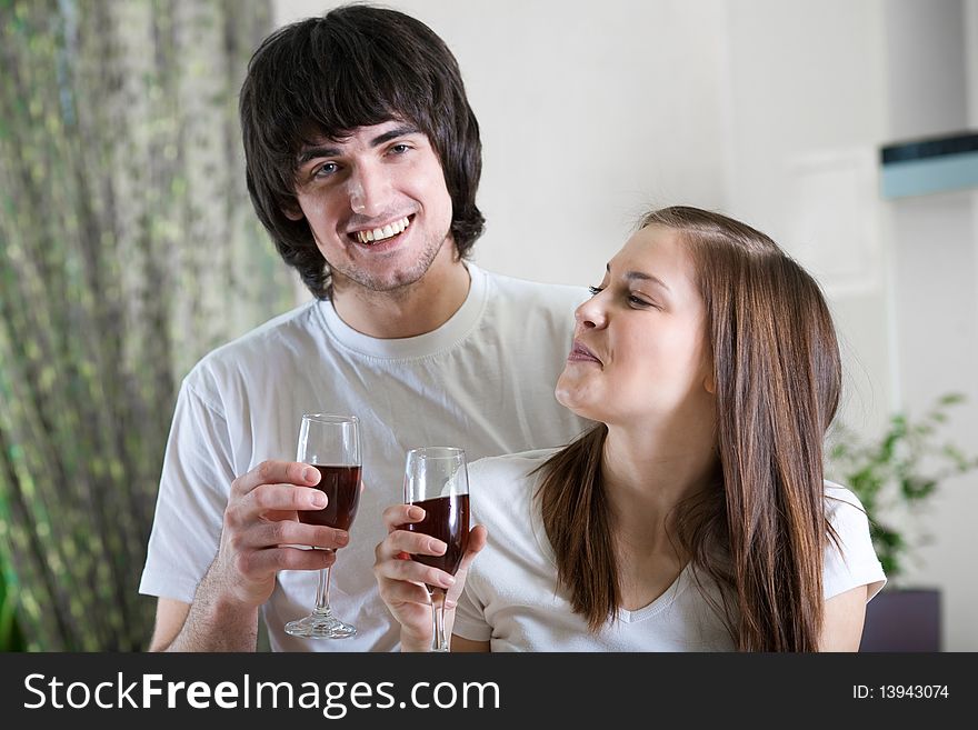 Boy with smile and nice girl with wineglasses. Boy with smile and nice girl with wineglasses