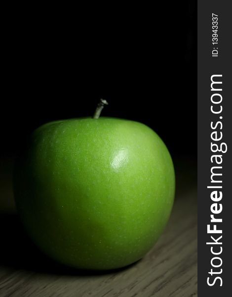 Fresh green apple with black background and shadow. Fresh green apple with black background and shadow
