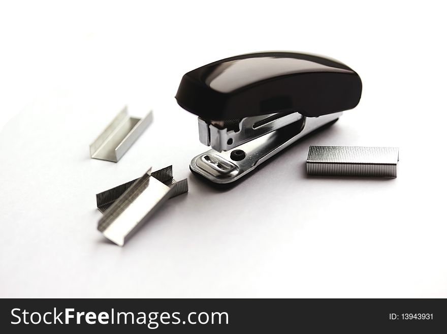 Black mini stapler and clips (small depth of sharpness). Black mini stapler and clips (small depth of sharpness)