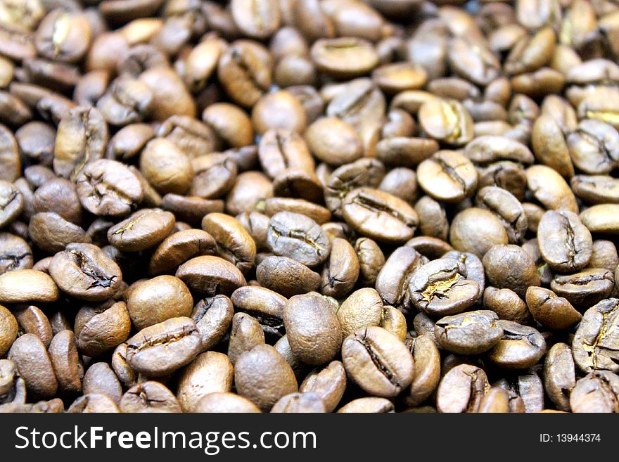 A bed of coffeebeans for background use. A bed of coffeebeans for background use.