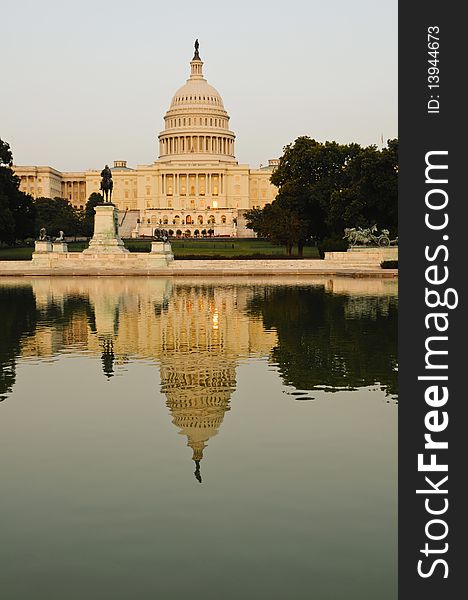 Capitol Building in Washington DC with water in foreground at sunset. Capitol Building in Washington DC with water in foreground at sunset