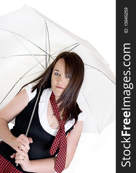 Woman dressed up as a schoolgirl holding a parasol. Woman dressed up as a schoolgirl holding a parasol.