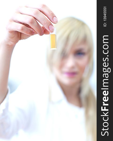 Closeup of a female researcher carrying out experiments in a lab