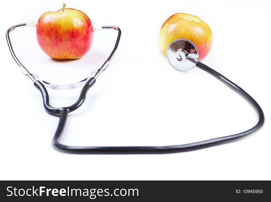 Stethoscope and apples over white background used as health and healty lifestyle symbol.