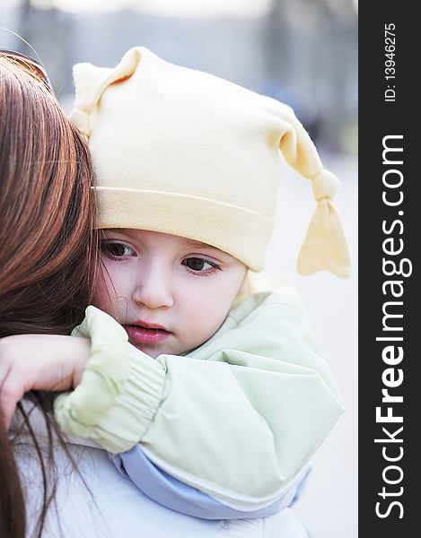 Mother holds little girl on hands. Mother holds little girl on hands