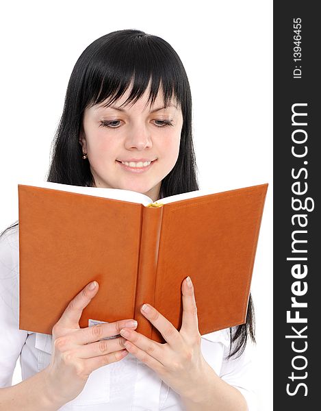Portrait of the young woman reading the book on a white background. Portrait of the young woman reading the book on a white background