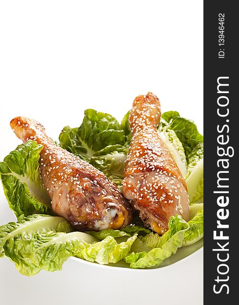 Caramelized chicken thighs with sesame and lettuce