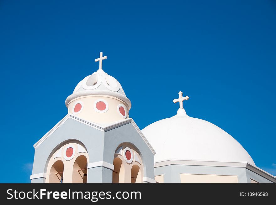 Greek church in santorini greece with a cross