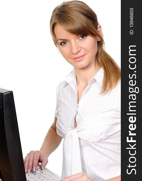 Business woman portrait smiling in front of her desktop computer. Business woman portrait smiling in front of her desktop computer.