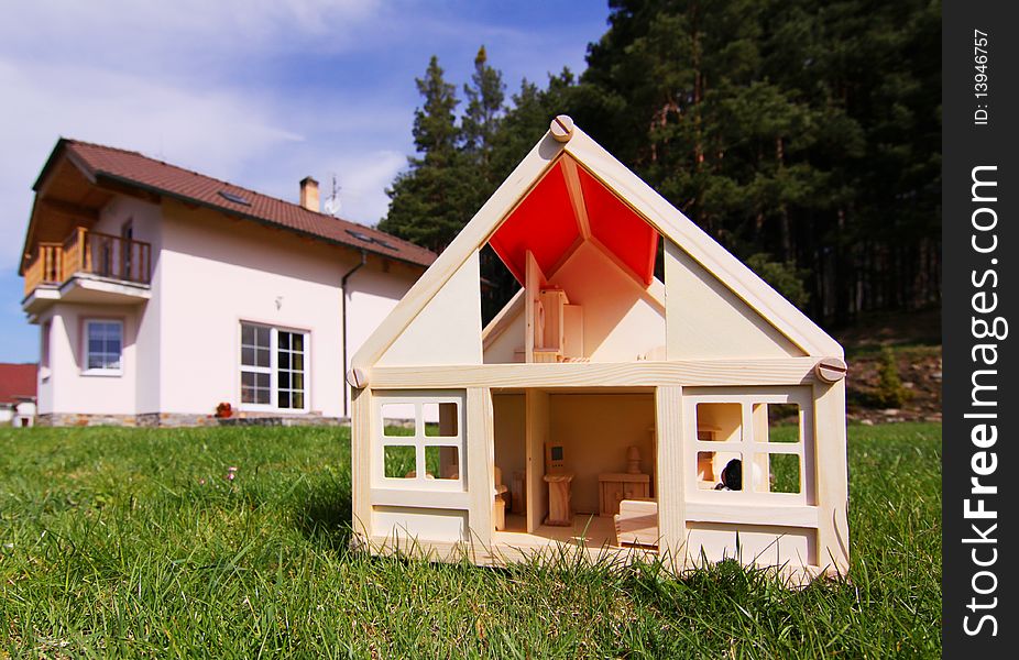 Model house and the house in real size. Model house and the house in real size