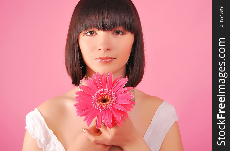 The young lady on the Grey background in studio