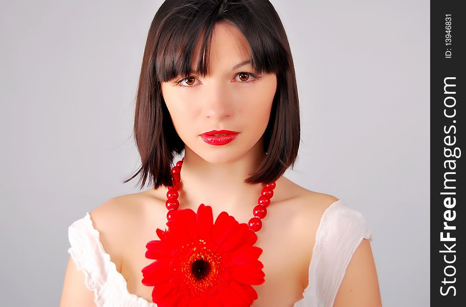 The young lady on the white background in studio