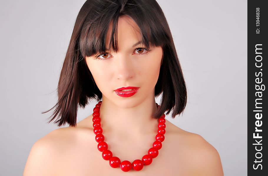 The young lady on the white background in studio