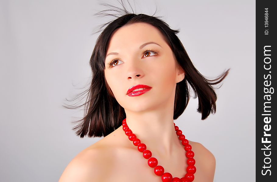 The young lady on the white background in studio