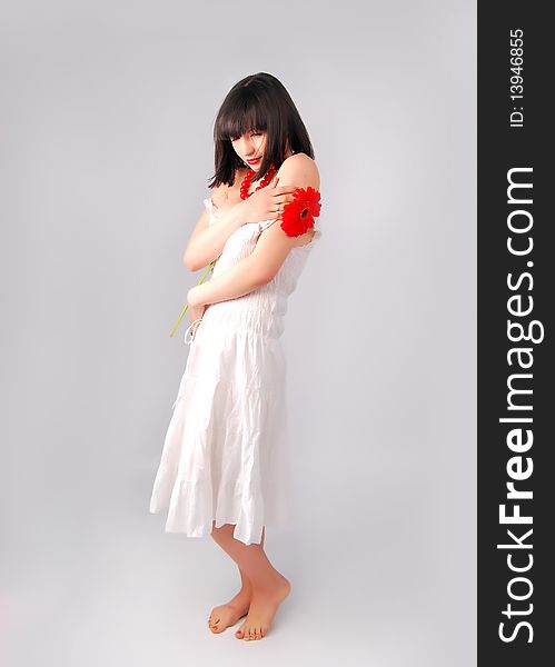 The young lady on the white background in studio