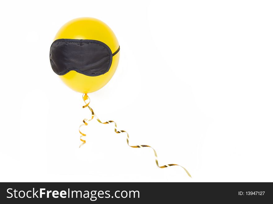 Yellow balloon in the mask on a white background