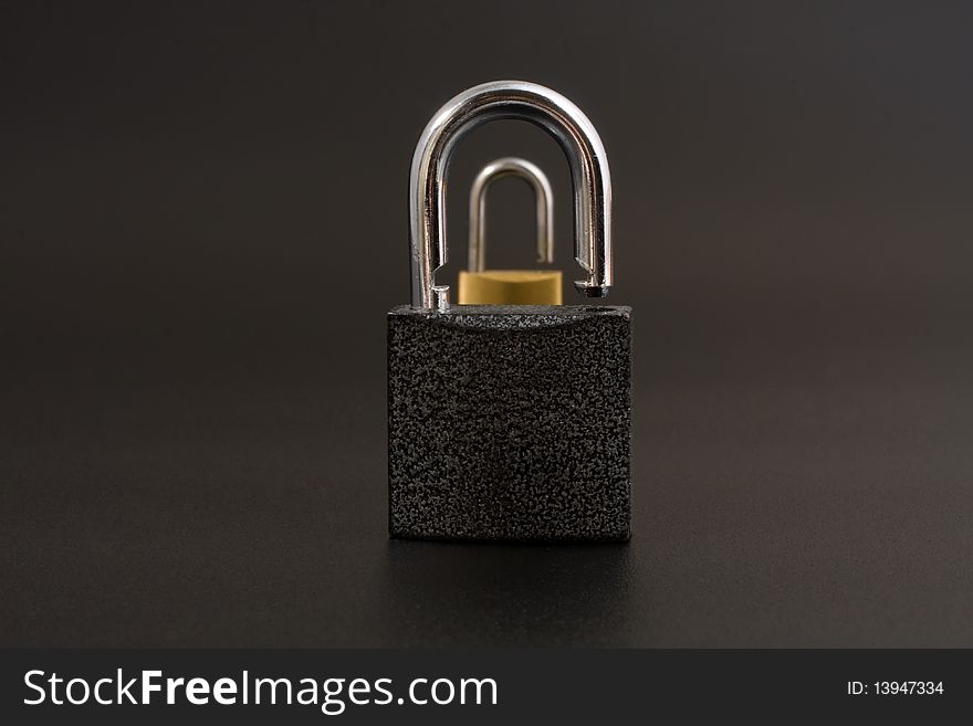 Two locks on a black background. Two locks on a black background