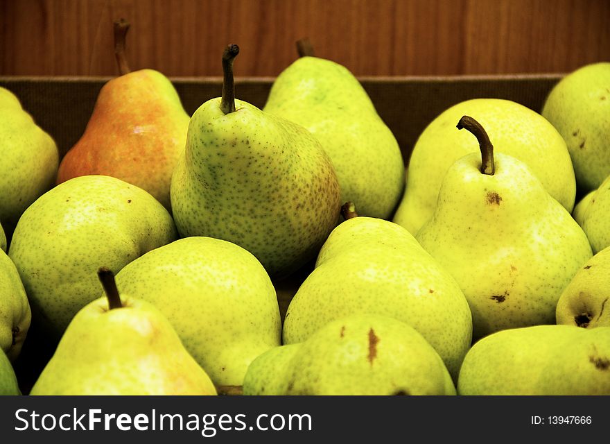 Basket of ripe pears up close