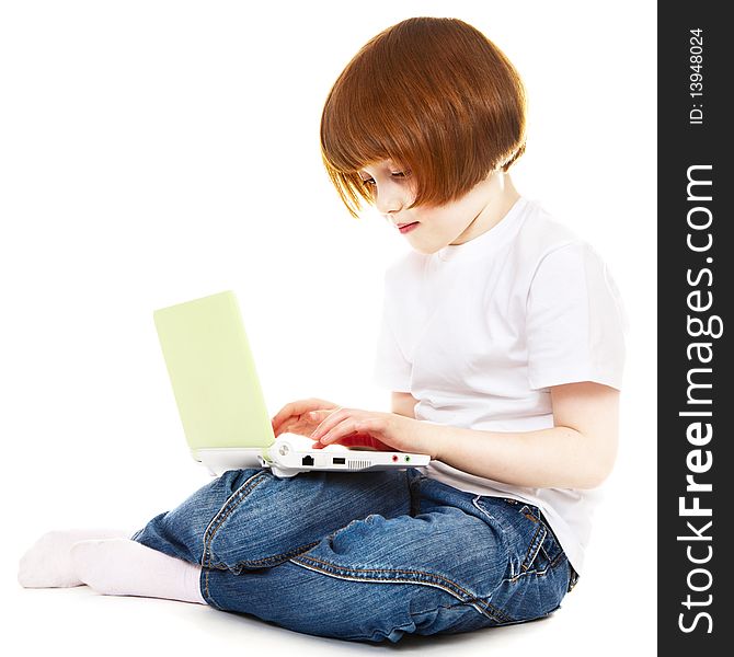Little girl using laptop over white