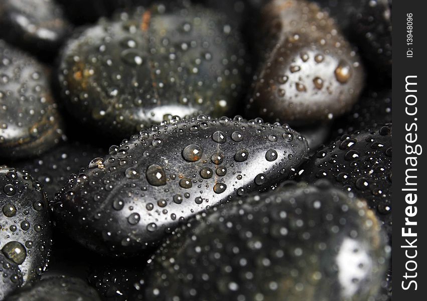 Spa black stones with water drops