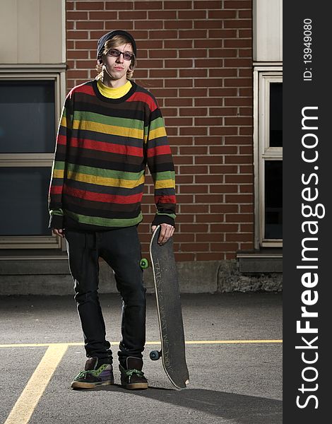 Fashion Portrait Of Young Skateboarder