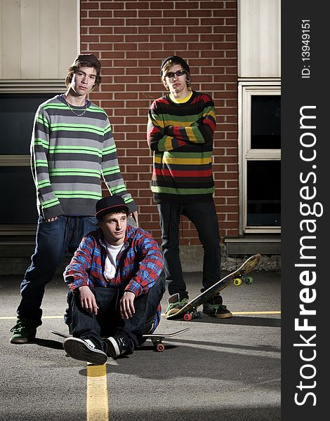 Three Skateboarder Friends Standing Together