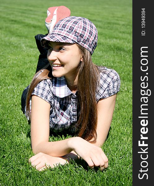 Young caucasian girl on the grass